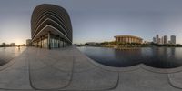 the photo is very distorted with its reflection on the water and buildings in the background