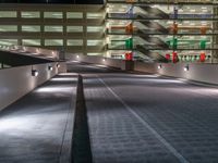 a view of a road and an overpass with traffic passing through it by buildings