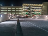 a view of a road and an overpass with traffic passing through it by buildings