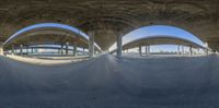 a photo taken through a 360 - wheel lens to show a tunnel in an empty parking lot