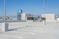 there is a view of the city from this rooftop parking lot area, where the city skyline can be seen