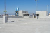 there is a view of the city from this rooftop parking lot area, where the city skyline can be seen