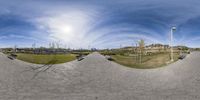 a fish eye view of a skate park area with benches on it and people walking