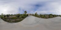 a man rides a skateboard on a big skate board ramp at the park outside