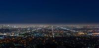 the city lights are bright and clear from within the sky as seen from above los at night