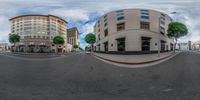 an oval lens image shows a city street and buildings as seen from a fish eye view