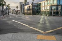 there are cars on a street at an intersection under a cloudy sky on a sunny day