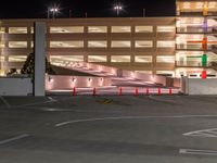 a view of a road and an overpass with traffic passing through it by buildings