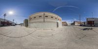 there is a 360 - view looking street in the neighborhood and it is empty and a big round building