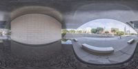 two fish eyes showing the inside of a building with benches and a bench in the center