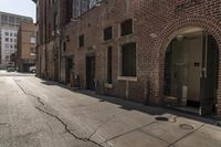 this is an empty street in the city with no cars and there is a man walking behind it