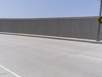 Los Angeles Urban Street: Metal Fence and Cityscape