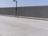 Los Angeles Urban Street: Metal Fence and Cityscape