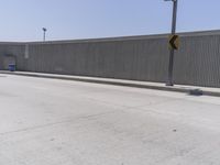 Los Angeles Urban Street: Metal Fence and Cityscape