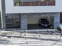 the exterior and landscape of a modern house in los angeles, california with stone and wood