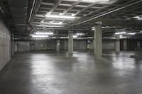 an empty storage room in an industrial building with light coming from the window above the ceiling