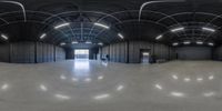 a 360 - shot photograph taken in a building with cement floors and a metal roof