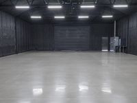 this is an image of a large empty warehouse with a door that opens on either side