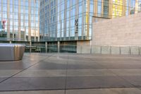 a close - up shot of the outside of an office building with a trash can