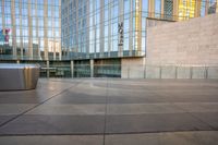 a close - up shot of the outside of an office building with a trash can