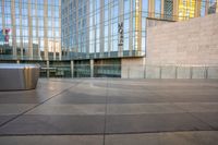 a close - up shot of the outside of an office building with a trash can