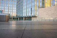 a close - up shot of the outside of an office building with a trash can