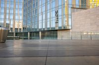 a close - up shot of the outside of an office building with a trash can