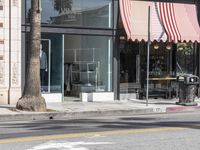 an open and empty storefront with no cars parked in front of it's door