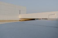 the view from outside of an industrial building, from below, of a flooded area