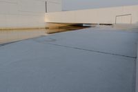 the view from outside of an industrial building, from below, of a flooded area