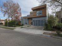 a large modern home is featured as a residential street in this upscale neighborhood with a wooden paneled wall