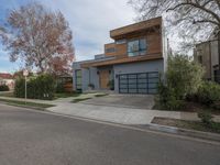 a large modern home is featured as a residential street in this upscale neighborhood with a wooden paneled wall