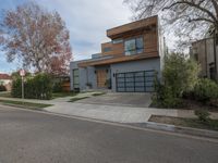 a large modern home is featured as a residential street in this upscale neighborhood with a wooden paneled wall