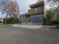 a large modern home is featured as a residential street in this upscale neighborhood with a wooden paneled wall