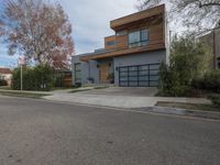 a large modern home is featured as a residential street in this upscale neighborhood with a wooden paneled wall