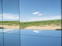 Lush Green Field in Europe: Clear Skies and Tranquility