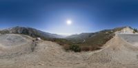 there are two people doing skateboards on a slope at the same time, and the camera shows a panoramic view