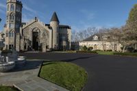 the stone chapel of the lutheran church is surrounded by flowers and fountain with statue at the center of the yard