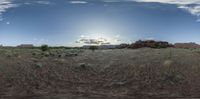 an image of a panorama fish eye lens at sunset on a cloudy day in the desert