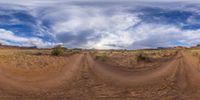 this 360 - view has been edited to reveal an image of a desert road and trees