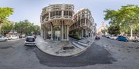 an empty street in a city is shown with a fish eye lens as the traffic is moving through the intersection