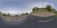 three different shots of the road being made with a fish eye lens, and on top of some rocks