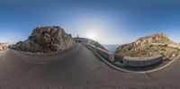 a panorama of a curved mountain road, next to a cliff with a lighthouse in the middle