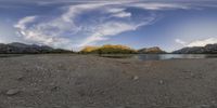 the mountain top is in this image with an eye panoramic view of the water