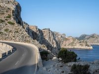 an empty highway winds off into the mountainside in california's cabo mountains