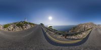 fish eye view of the road that leads to a lighthouse at the top of a cliff