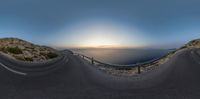 a fish eye lens of a road and the ocean at dusk in a 3d view