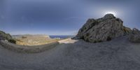 there is a view of a large mountain on a sunny day, and you can see the sky in this 360 - turn