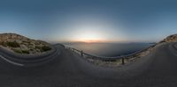 360 lens view of the road that winds its way to the top of a mountain