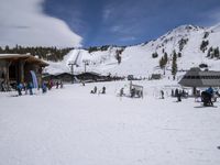 several skiers standing in front of the lodge on a snowy day, the lodge is covered with tall pines and snow